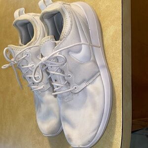 Women’s white Nike running sneakers